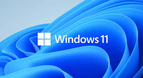Logo Windows 11 na tle falujących, niebieskich kształtów. Czekasz na aktualizacje Windows 11?