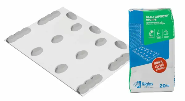 Płyta gipsowo-kartonowa z fazowaniem, obok worek kleju gipsowego Rigips.