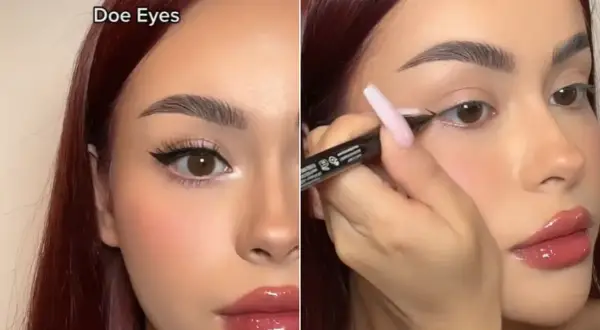 Kobieta z brązowymi włosami tworzy makijaż typu "doe eyes", podkreślając swoje duże, okrągłe oczy eyelinerem.