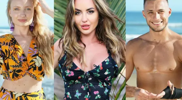 Trójka uczestników Hotel Paradise 2: blondynka w pomarańczowym stroju, brunetka w kwiecistej sukience i mężczyzna z opaską na ręce na tle plaży.