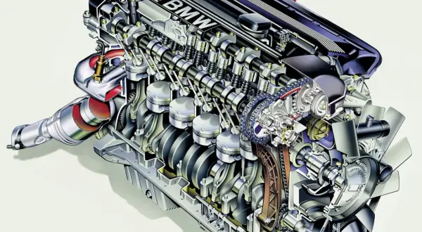 Przekrój silnika BMW M52 z widocznymi tłokami, wałkami rozrządu i turbosprężarką.