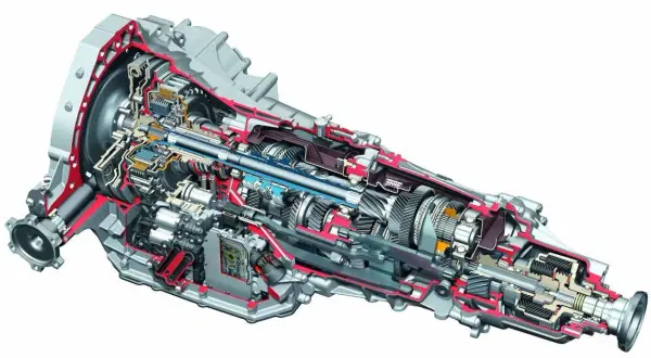 Przekrój skrzyni biegów do Audi z silnikiem 3.0 TDI. Widoczne koła zębate, wałki i elementy hydrauliczne.