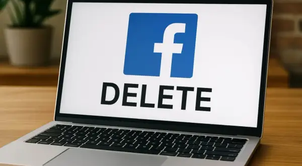 Laptop z logo Facebook i napisem "DELETE". Chcesz wiedzieć, jak usunąć profil na FB? Ten obrazek pokazuje, że to możliwe.