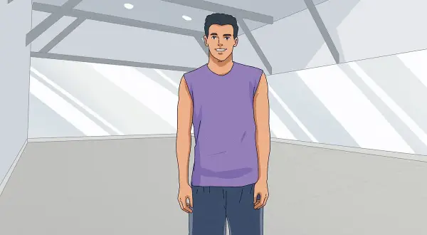 A man in athletic wear stands ready for shadow boxing in an empty gym.