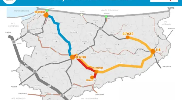 Mapa kolejowa Warmii i Mazur pokazuje połączenia między Olsztynem, Ełkiem, Giżyckiem i Braniewem, z zaznaczonymi trasami i miastami.
