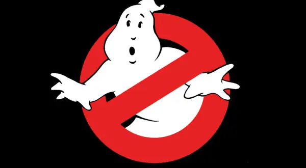 The iconic Ghostbusters logo featuring a white, surprised-looking ghost behind a red prohibition sign.