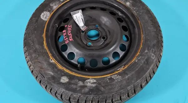 Koło zapasowe do Opel Astra G, z widocznym rozstawem śrub. Opona Continental 185/65 R15.