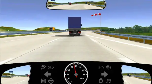 Ein roter und weißer seitenwind schild warnt vor starkem Seitenwind auf der Autobahn.