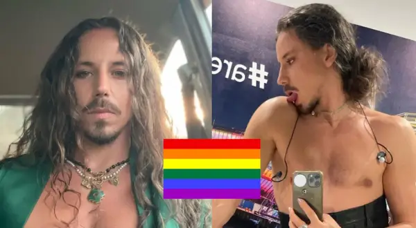 Michał Szpak w zielonej marynarce i z naszyjnikami, obok tęczowa flaga. Czy Michał Szpak ma żonę? Piosenkarz w lustrze.