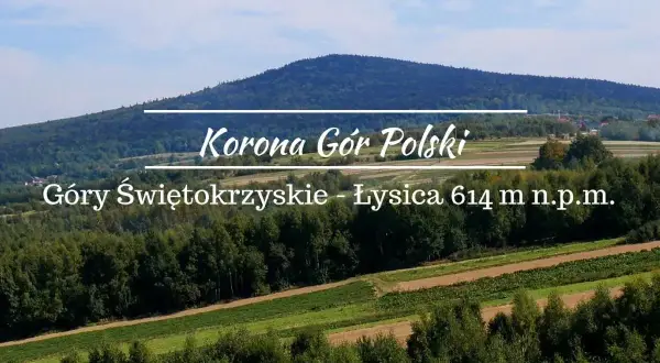 Łysica, najwyższy szczyt Gór Świętokrzyskich, wznosi się majestatycznie na tle błękitnego nieba.