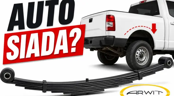 Biały pickup z napisem "AUTO SIADA?". Obok leży resor piórowy, sugerując problem z zawieszeniem.