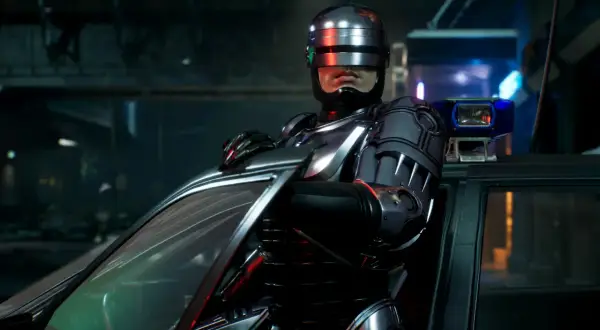 RoboCop w zbroi opiera się o samochód, gotowy do akcji w grze RoboCop: Rogue City.