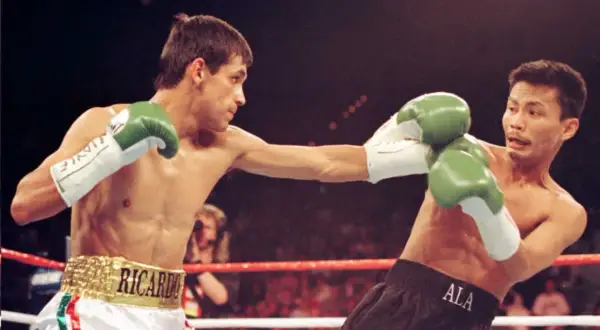 Boxer Ricardo "Finito" Lopez lands a punch in a light flyweight bout.