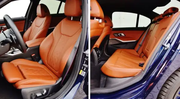 Wnętrze BMW z brązową skórzaną tapicerką foteli.