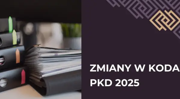 Stos dokumentów w segregatorach z kolorowymi zakładkami.
