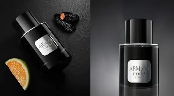 Eleganckie perfumy męskie Armani Code Elixir w czarnej butelce, obok pomarańczy i daktyli.