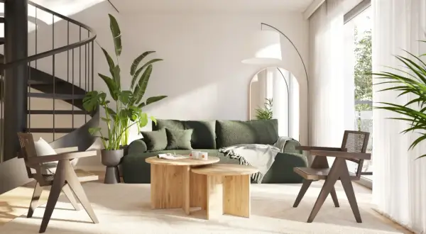 Nowoczesny salon z zieloną sofą i drewnianymi meblami. Idealne miejsce na wakacyjny **wynajem apartamentów nad morzem**.