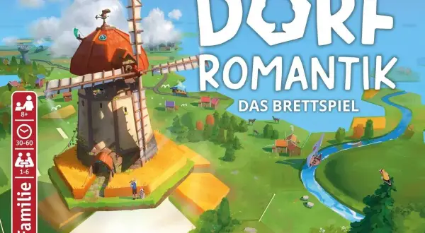 Das Brettspiel "Dorfromantik" lädt zum Bauen und Gestalten ein. Ein Windrad dominiert die idyllische Landschaft.