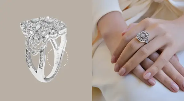 Anillo de plata 925 con incrustaciones de diamantes, con un diseño floral y de corazones. La marca de plata 925 es visible.