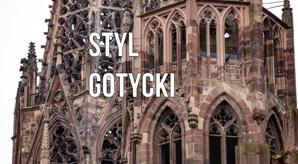 Kamienna katedra z licznymi zdobieniami, ostrymi łukami i rozetami. Widoczne są charakterystyczne cechy stylu gotyckiego: strzelistość, bogactwo detali architektonicznych i kamienne gargulce.