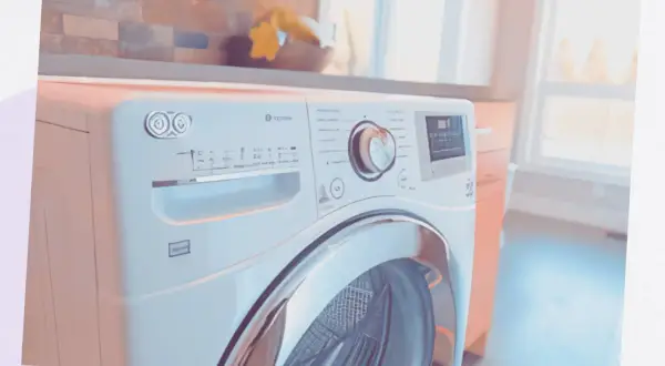 Un sèche-linge moderne dans une buanderie. Il est blanc avec une porte en verre chromé. Le panneau de commande est visible, avec un cadran et des boutons. On se demande combien de temps dure un sèche-linge pour un cycle complet.