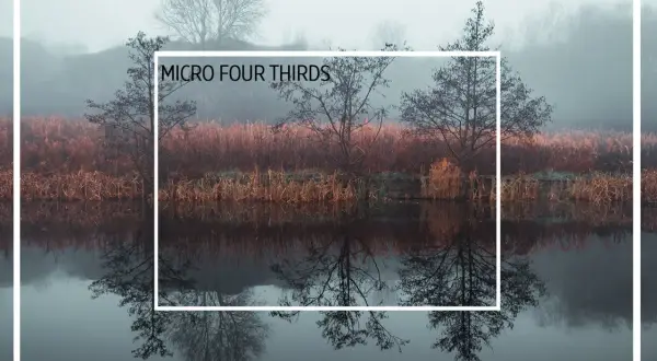 Full frame vs. Micro Four Thirds sensor comparison, showing how the MFT crop factor zooms in on a misty landscape with reflections.