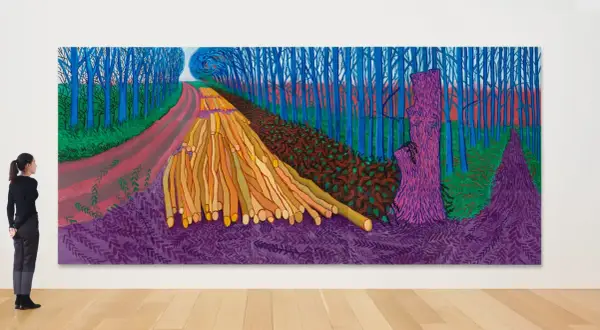 A contemporary landscape painting depicts a vibrant forest scene with a winding path, stacked logs, and a striking purple tree stump.