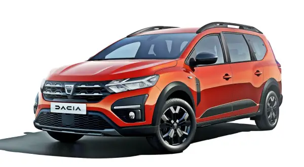 Pomarańczowy Dacia Jogger, marka samochodu na d, z relingami dachowymi i czarnymi dodatkami.