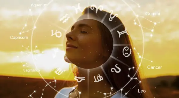 Una mujer con los ojos cerrados, rodeada por el zodíaco y constelaciones, como un ser de luz en armonía con el universo.