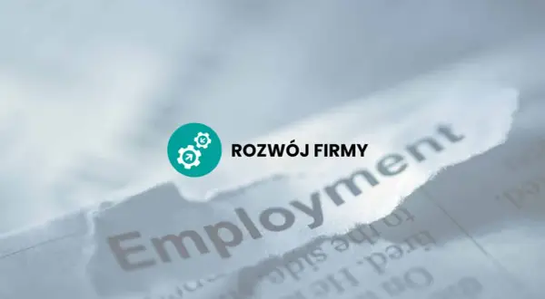 Rozwój firmy i prawa pracodawcy. Słowo "Employment" na podartym papierze.