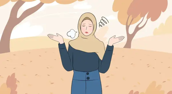 En kvinna i hijab med uppgivna armar och en suckande min, omgiven av höstlöv. Hon söker efter sätt att få bort ångest snabbt.