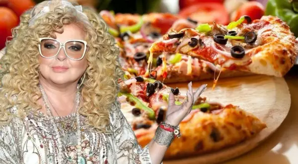 Magda Gessler z pizzą, ser ciągnie się z kawałka.