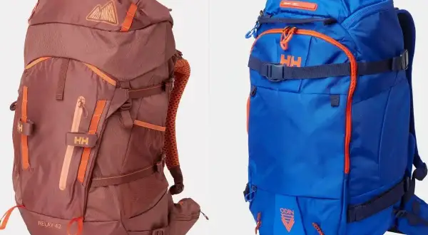 Dos mochilas, una marrón y otra azul, listas para preparar la mochila para una aventura.