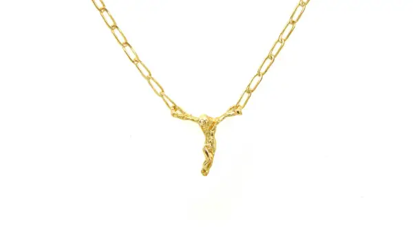 Collar de oro con un Cristo crucificado, inspirado en el estilo de Dalí.