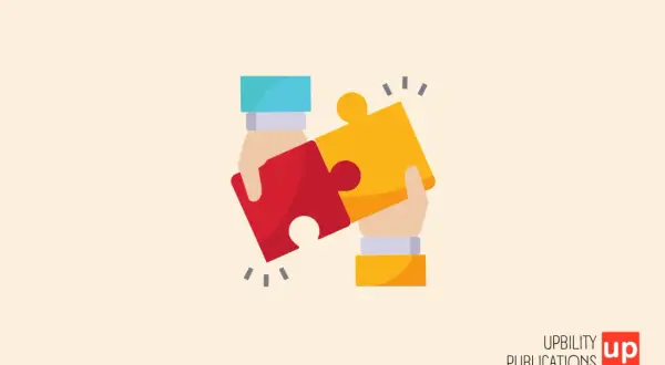 Due mani uniscono due pezzi di puzzle, simboleggiando l'unione e la comprensione per la sindrome di Down e l'autismo.