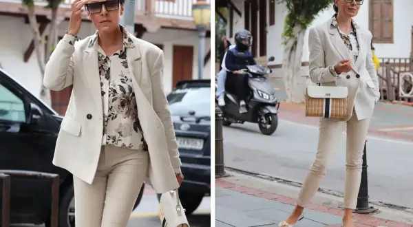 Elegancka stylizacja, która pokazuje, czego nie nosić po 60. – jasny garnitur, kwiecista koszula i stylowa torebka.