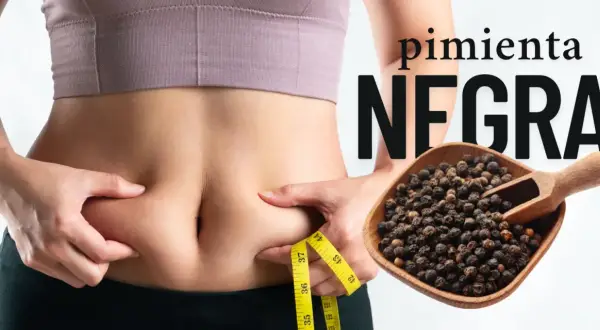 Pimienta negra: descubre sus propiedades para tu figura. Una persona se pellizca la cintura con una cinta métrica.