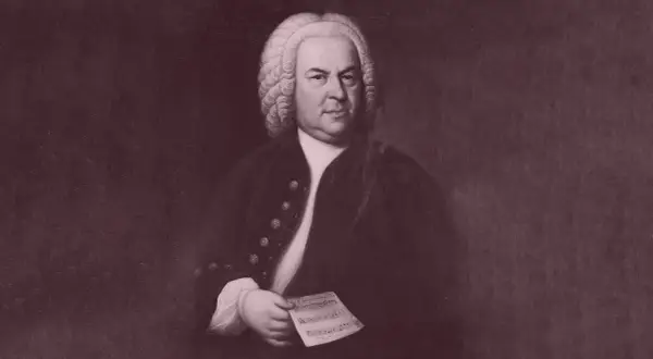 Porträtt av Johann Sebastian Bach, med noter i handen. Hans musik fortsätter att inspirera.