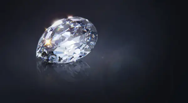 Błyszczący diament, wielka gwiazda Afryki, odbija światło na ciemnym tle.
