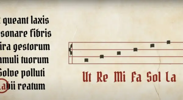 Note musicali su pentagramma, con testo latino e nomi delle note Ut, Re, Mi, Fa, Sol, La.