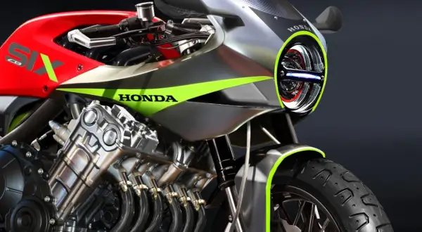 Motocykl Honda z silnikiem 6-cylindrowym, czerwony bak z napisem SIX, srebrne owiewki z zielonymi akcentami.