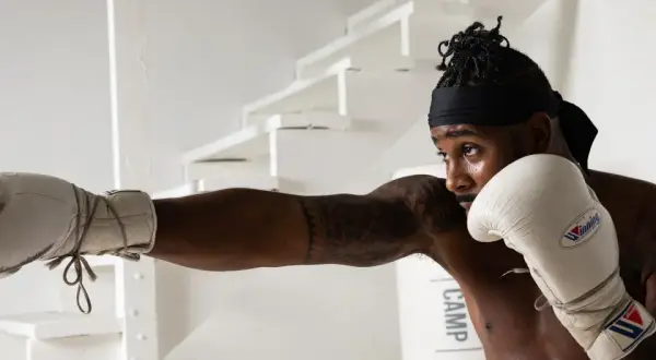 A boxer throws a punch, showcasing the precision and strategy that makes boxing the sweet science.