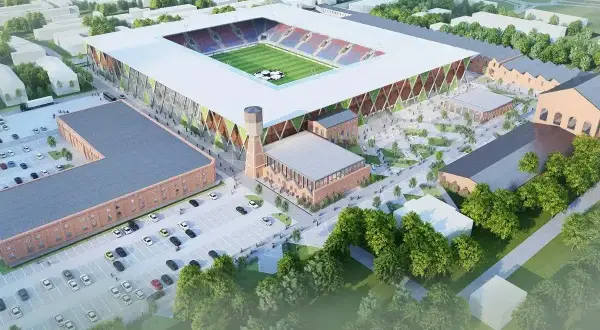 Nowy stadion Rakowa z imponującą pojemnością, otoczony historyczną architekturą i nowoczesnymi przestrzeniami.