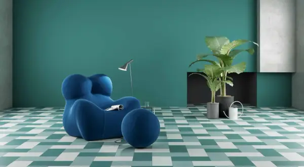 Un soggiorno moderno con poltrona blu e piante verdi, su pavimenti ecosostenibili a fantasia geometrica.