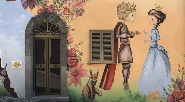 Un principe offre un fiore a una principessa, circondati da fiori e un volpe. Sembra un dipinto del paese delle fate.