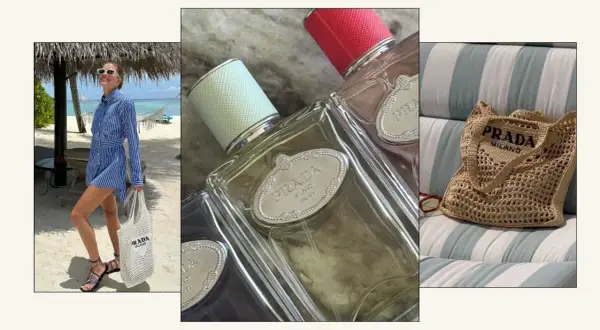 Kobieta na plaży z torbą Prada, butelki perfum Prada i pleciona torba Prada. Zapach Prada Rose idealny na wakacje.