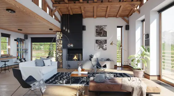 Gemütliches Wohnzimmer mit Kamin, Ledersofa und Skiern – moderne wohn trends im Alpenstil.