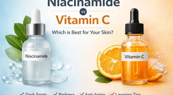 Niacinamide vs. Vitamin C: Welches ist besser für Ihre Haut? Seren mit Niacinamide und Vitamin C, Orangen und Blätter.