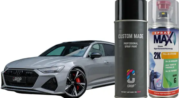 Elegancki samochód w kolorze nardo grey obok puszek z farbą w sprayu. Idealny do odświeżenia lakieru.