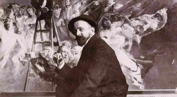 Malczewski obrazy: artysta w kapeluszu przed malowidłem z drabiną i postaciami.